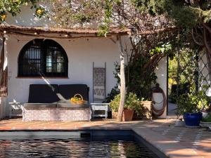 a house with a swimming pool in front of a house at Boutique Finca Stay in Nature in Mijas