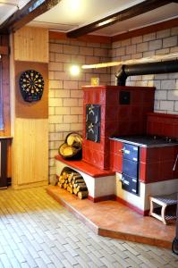 a kitchen with a red stove in a room at Chata Mir in Dolní Bečva +54 photos