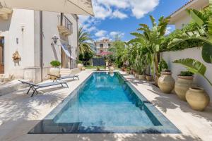 a swimming pool in the backyard of a house at Villa Raphael in Avola