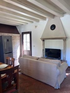 a large bed in a room with a fireplace at Villa Riviera in Mira
