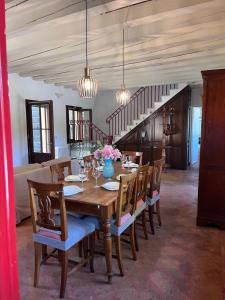 a dining room with a wooden table and chairs at Villa Riviera in Mira