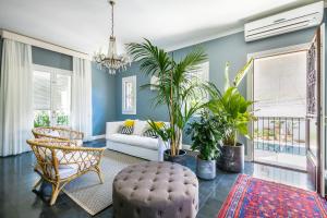 a living room with a couch and some plants at Villa Raphael in Avola +137 photos