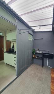 a room with a sliding glass door with a counter at Blessed Homes in Braço do Norte