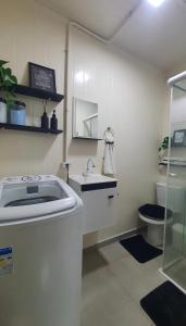 a bathroom with a sink and a toilet at Blessed Homes in Braço do Norte +5 photos