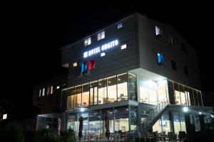 a building with a sign that reads hotel union at Bar Hotel Orgito in Lushnjë