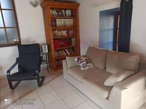 a living room with a couch and a chair at Gite à Valleraugue Gard Cevennes in Valleraugue