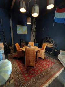 a dining room with a table and chairs at Farmstay Zijperdijk in Anna Paulowna