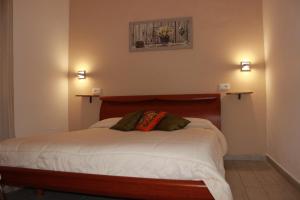 a bedroom with a bed with two pillows on it at B&B Raggi d'Ischia - nuova gestione 2026 in Casamicciola Terme