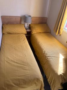 two beds sitting next to each other in a room at Ocean View At Glade in Bucks Mills +15 photos