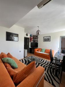a living room with a couch and a table at Sheshi-Prizren in Prizren