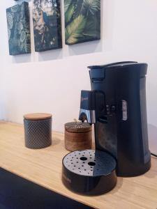a coffee maker sitting on top of a counter at "KALEE" Appartement T3 Terrasse avec petit jardin in Lanester