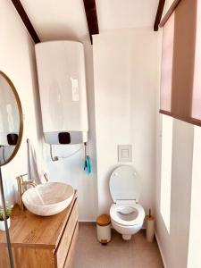 a bathroom with a white toilet and a sink at Lemba, apartman 4 zvjezdice in Opuzen +51 photos
