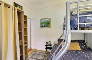 a small room with a bunk bed and a staircase at Le paradis bleu azur in Ensuès-la-Redonne