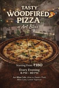 a poster for a pizza restaurant with a pizza at Art Bliss Rishikesh - Yoga Hostel & Café in Rishīkesh