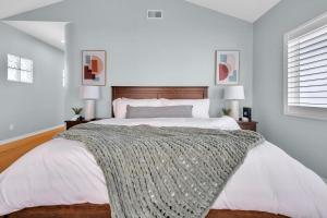 a bedroom with a large bed and two lamps at Near Oceanside Pier! Pirate in Oceanside