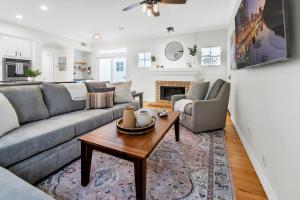 a living room with a couch and a table at Near Oceanside Pier! Pirate in Oceanside