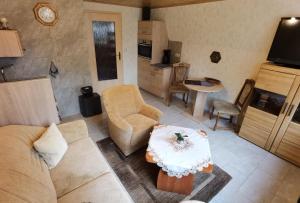 a living room with a couch and a table at Finnhütte Tanne in Tanne