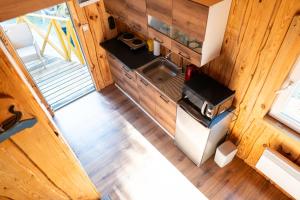 an overhead view of a kitchen in a tiny house at Лісова Хатка in Parowa