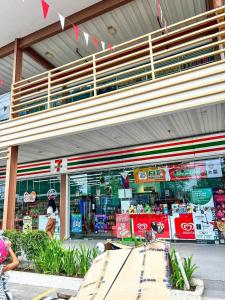 a store front of a grocery store with at Near Mactan Airport, Pool, Fast WiFi, Netflix & Disney in Lapu Lapu City