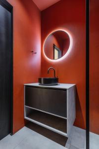 a bathroom with a sink and a mirror at Kabiny Kravák in Znojmo +25 photos