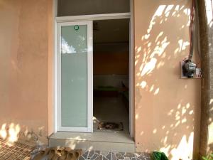 a door to a house with a pizza inside at Kim An Sadec Garden House in Ấp Tân An (2)