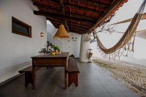 a room with a wooden table and a ceiling at Casa da Ponte de Mucela in Vila Nova de Poiares