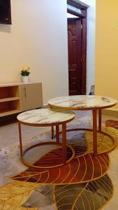 two tables sitting on top of a rug at Jayson Homes in Thika +3 photos