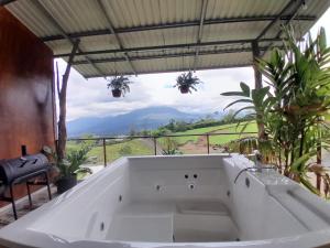 a bath tub in a room with a view at RIGE s Home in Palma