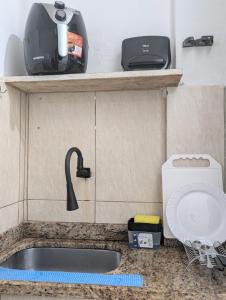 a kitchen counter with a sink and a mixer at Acomodaçao Ipanema in Rio de Janeiro