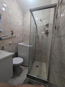 a bathroom with a shower with a toilet and a sink at Acomodaçao Ipanema in Rio de Janeiro +8 photos