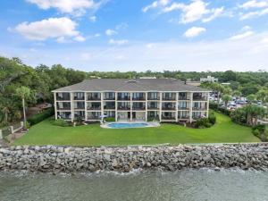 an aerial view of a large building with a swimming pool at Pier Pointe #101 - 100 Floyd Street, Unit 101 in Saint Simons Island