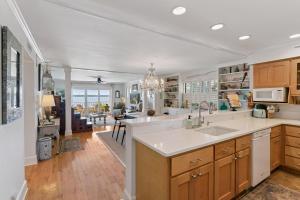 a kitchen with a sink and a counter top at Pier Pointe #101 - 100 Floyd Street, Unit 101 in Saint Simons Island