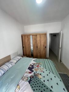 a bedroom with a large bed with at Apartamento en el centro vinaros in Vinarós +5 photos
