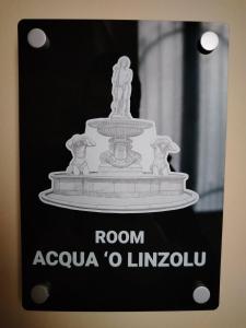 a picture of a fountain with the words room acula o linemahu at Sicilian Room in Catania