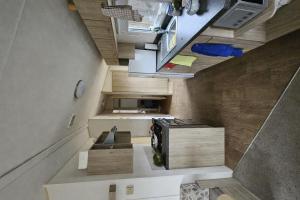 an overhead view of a kitchen in a tiny house at Maison de Lucie à Tholen in Poortvliet