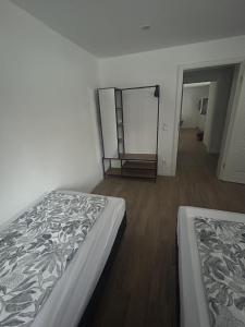 a bedroom with a bed and a mirror on the wall at Casita 2 in Essenbach