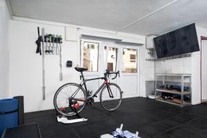 a bike is parked in a room with a room at Apartments Bodlovic - ZF Hvar in Hvar