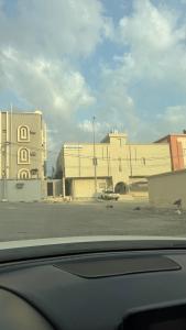 a view of a parking lot with a building at سويت بغرفتين نوم in Al Majaridah