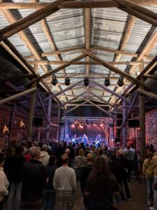 a crowd of people standing in front of a stage at Al Crott in Poschiavo
