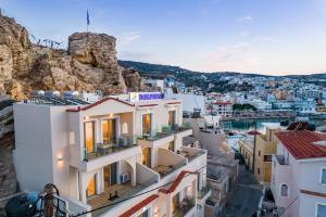 a view of a town with white buildings at Dolphin Hotel Apartments in Karpathos