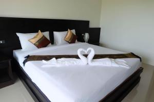 Postel nebo postele na pokoji v ubytování The Oasis Khaolak Resort - SHA Plus