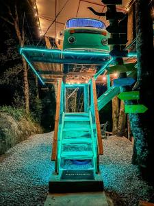 a playground with a blue slide and a ladder at Biciting Combi Love Glamping with Jacuzzi and Views in Mineral del Chico