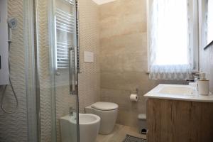 a bathroom with a shower and a toilet and a sink at IVAN house - TERRASINI SICILIA in Terrasini +29 photos