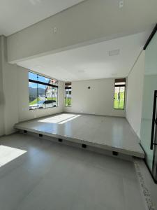 a large empty room with a bench in the middle at Castel Luz in Angelina