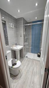 a bathroom with a shower and a toilet and a sink at Sidi Rahal Playa beach in Casablanca