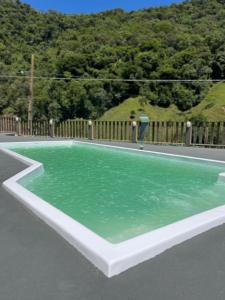a pool of green water in the middle of a road at Castel Luz in Angelina
