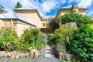 a house with a garden in front of it at The Globe Inn in Yass