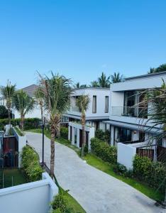 an aerial view of a building with palm trees at Minh Anh Hotel in Phú Quốc