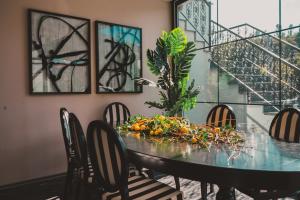 a dining room table with a bunch of fruit on it at Lemon Suites & Restaurant in Korucuk