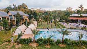 an overhead view of a pool at a resort at May Farm in Hương Hóa